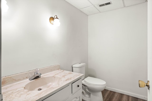 1219 Nicki Dr, Bloomington, IL 61704 - half bathroom with a drop ceiling, wood finished floors, and vanity