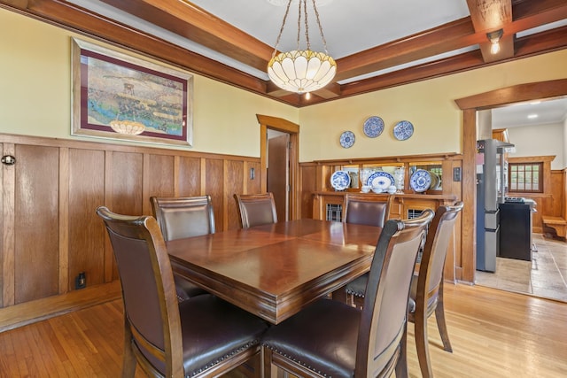 321 W Chebanse Ave, Chebanse, IL 60922 - dining area featuring light wood-type flooring and a wainscoted wall