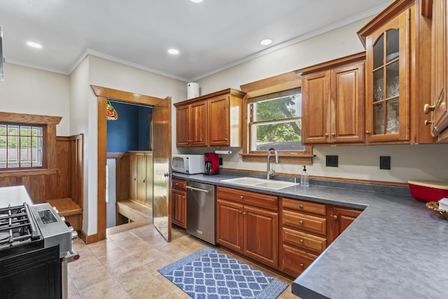 321 W Chebanse Ave, Chebanse, IL 60922 - kitchen featuring appliances with stainless steel finishes, brown cabinetry, crown molding, glass insert cabinets, and dark countertops