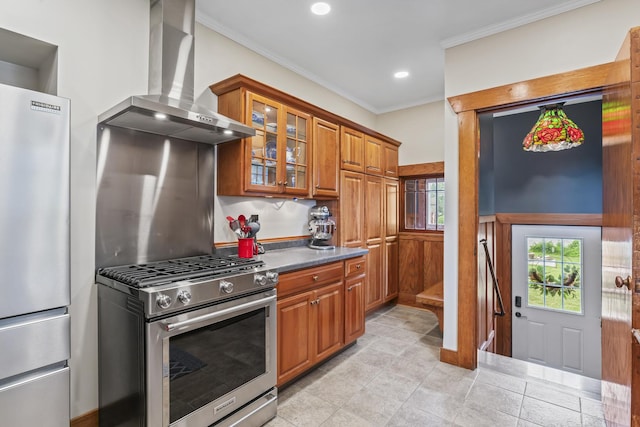321 W Chebanse Ave, Chebanse, IL 60922 - kitchen featuring wall chimney range hood, stainless steel appliances, brown cabinets, ornamental molding, and glass insert cabinets