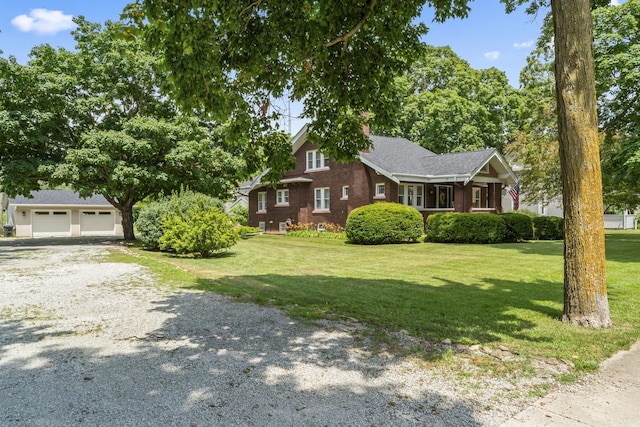 321 W Chebanse Ave, Chebanse, IL 60922 - view of property exterior featuring a garage, a lawn, and driveway