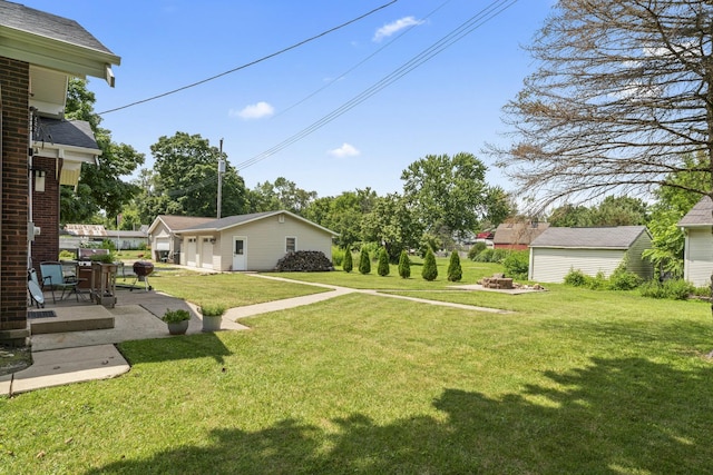 321 W Chebanse Ave, Chebanse, IL 60922 - view of grassy yard featuring a patio and a fire pit