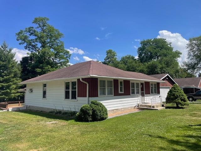 27569 N Beech St, Island Lake, IL 60042 - view of front facade with a front lawn and board and batten siding