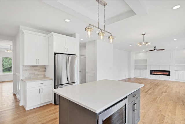16540 Pear Ave, Orland Park, IL 60467 - kitchen with freestanding refrigerator, light wood-style floors, recessed lighting, white cabinetry, and light countertops