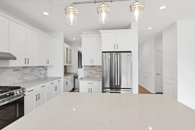 16540 Pear Ave, Orland Park, IL 60467 - kitchen with stainless steel appliances, light countertops, white cabinetry, recessed lighting, and backsplash