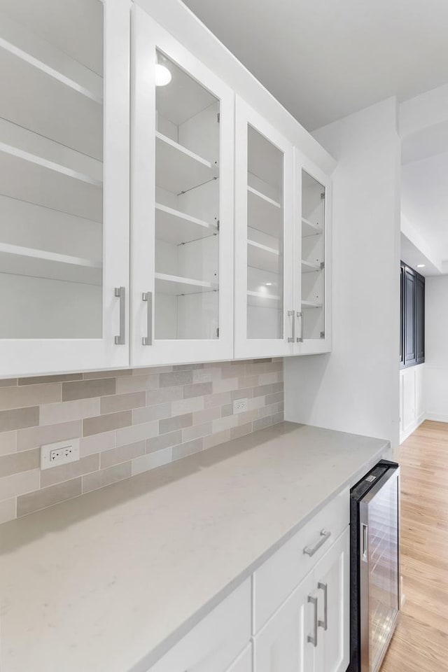 16540 Pear Ave, Orland Park, IL 60467 - indoor dry bar featuring beverage cooler, backsplash, and light wood finished floors