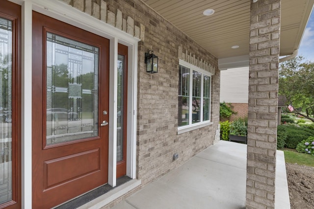 16540 Pear Ave, Orland Park, IL 60467 - doorway to property featuring covered porch and brick siding