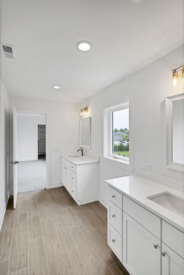 16540 Pear Ave, Orland Park, IL 60467 - full bath featuring two vanities, wood finish floors, and recessed lighting