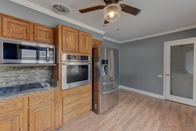 16218 Sussex Ct, Markham, IL 60428 - kitchen with stainless steel appliances, crown molding, light wood-style floors, ceiling fan, and tasteful backsplash