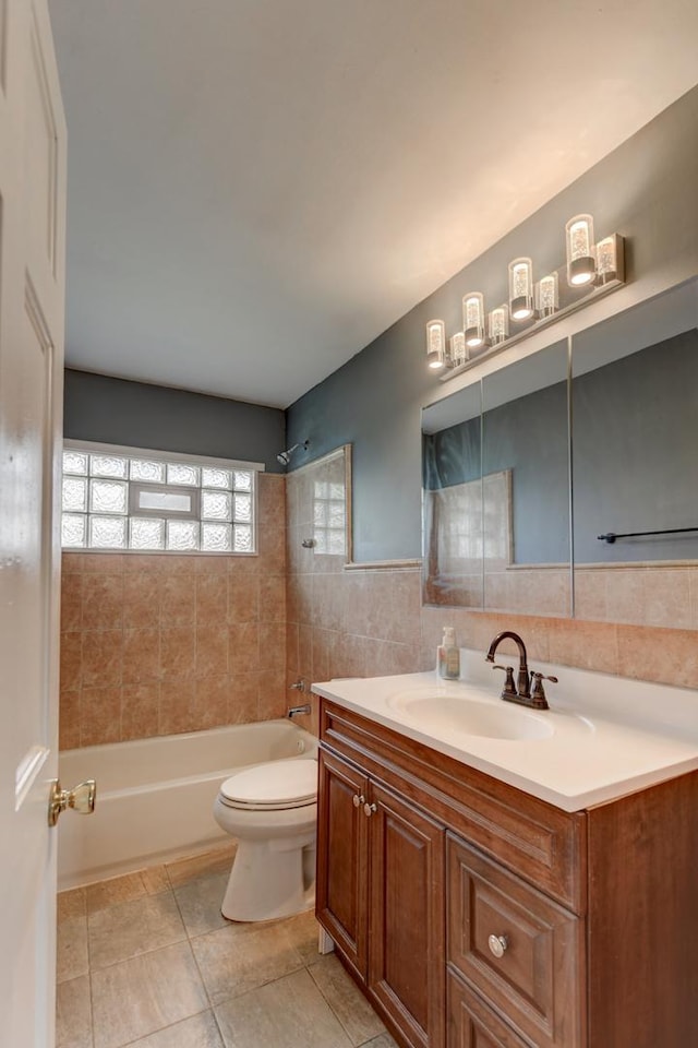 16218 Sussex Ct, Markham, IL 60428 - full bath featuring vanity, tub / shower combination, tile patterned floors, and tile walls
