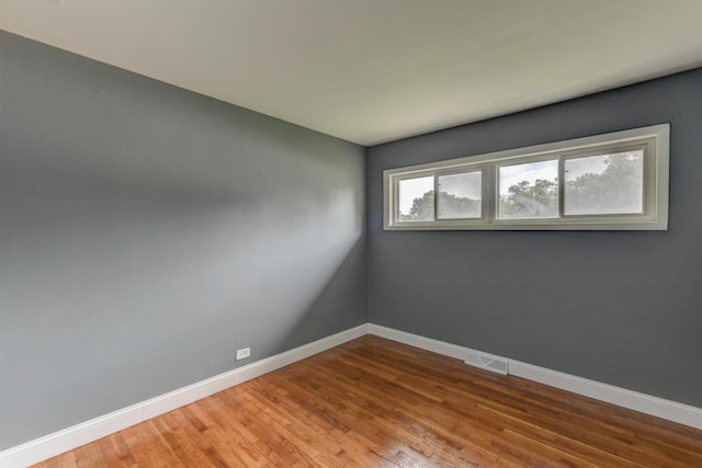 16218 Sussex Ct, Markham, IL 60428 - spare room with baseboards and wood finished floors