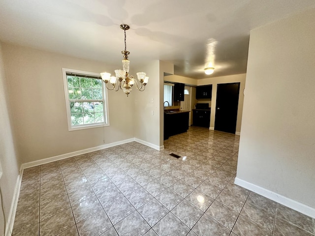 39 Leonard St, Elgin, IL 60123 - unfurnished dining area with a chandelier and light tile patterned floors