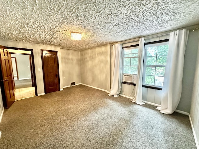 39 Leonard St, Elgin, IL 60123 - carpeted empty room with cooling unit and baseboards