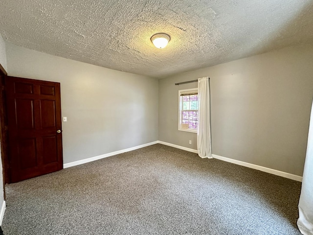 39 Leonard St, Elgin, IL 60123 - carpeted spare room featuring baseboards and a textured ceiling