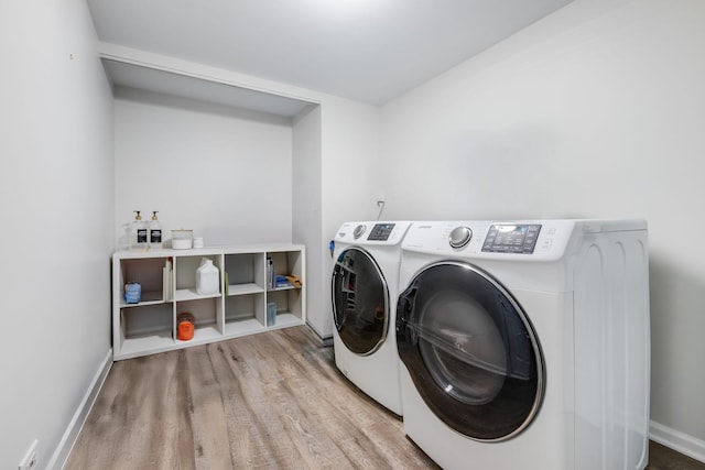 1356 Geneva Ln, Cary, IL 60013 - laundry area with separate washer and dryer and wood finished floors