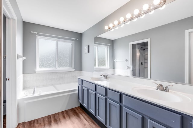 1356 Geneva Ln, Cary, IL 60013 - full bath featuring double vanity, a bath, a shower, and wood finished floors