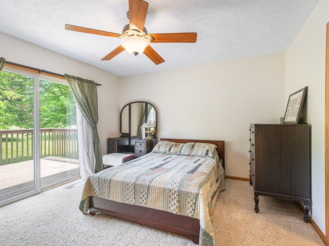 1375 Coven Cir, Davis, IL 61019 - carpeted bedroom with access to exterior, a textured ceiling, and a ceiling fan
