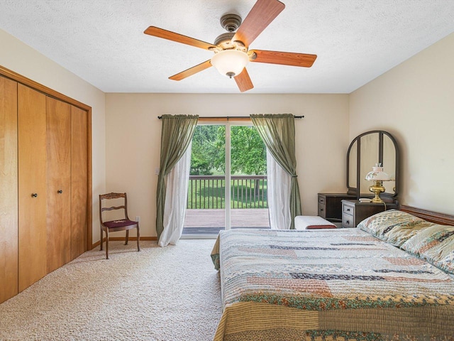 1375 Coven Cir, Davis, IL 61019 - carpeted bedroom with access to outside, a textured ceiling, ceiling fan, and a closet