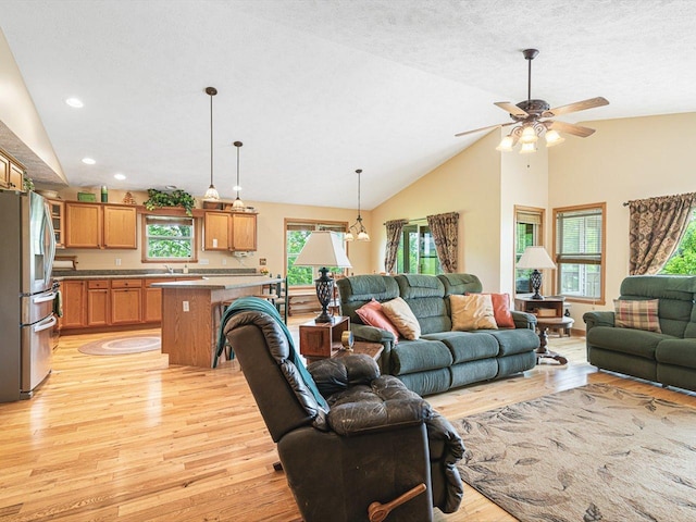 1375 Coven Cir, Davis, IL 61019 - living area featuring light wood finished floors, ceiling fan, recessed lighting, and high vaulted ceiling