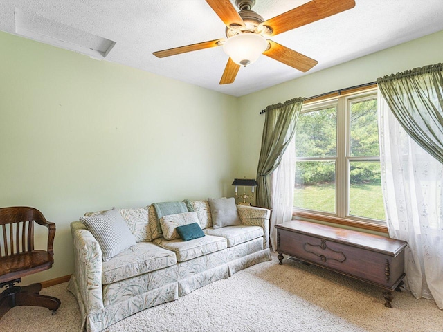 1375 Coven Cir, Davis, IL 61019 - carpeted living room featuring ceiling fan and a textured ceiling