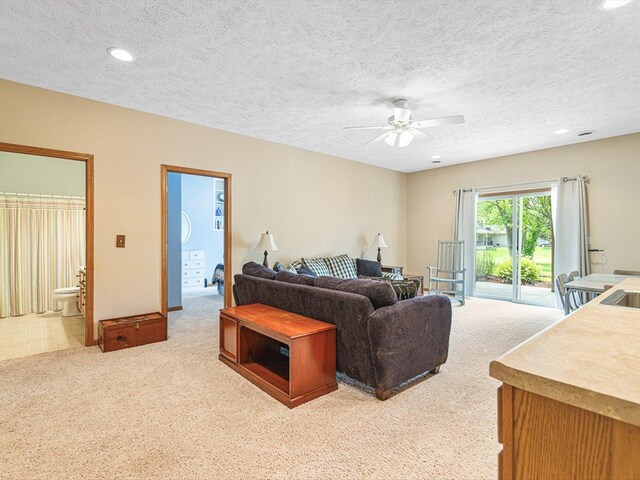 1375 Coven Cir, Davis, IL 61019 - living area with light colored carpet, ceiling fan, recessed lighting, and a textured ceiling