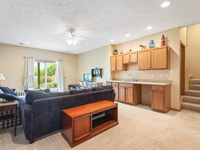 1375 Coven Cir, Davis, IL 61019 - living room with light carpet, a textured ceiling, recessed lighting, stairway, and ceiling fan