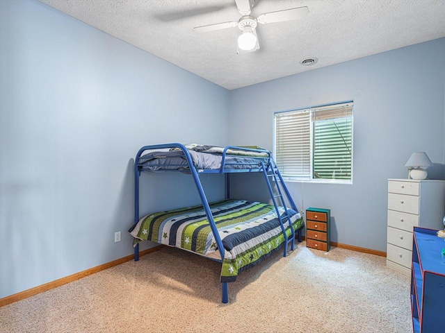 1375 Coven Cir, Davis, IL 61019 - bedroom featuring carpet, a textured ceiling, and a ceiling fan