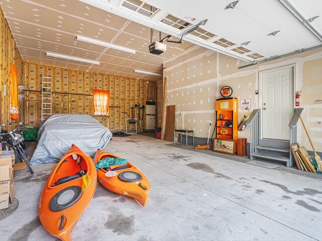 1375 Coven Cir, Davis, IL 61019 - garage with a garage door opener