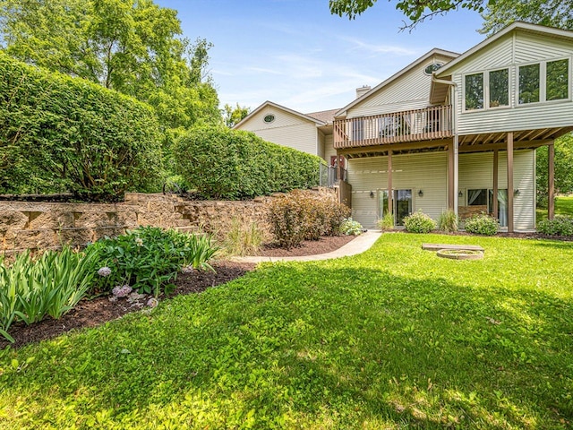 1375 Coven Cir, Davis, IL 61019 - rear view of house featuring a deck and a lawn