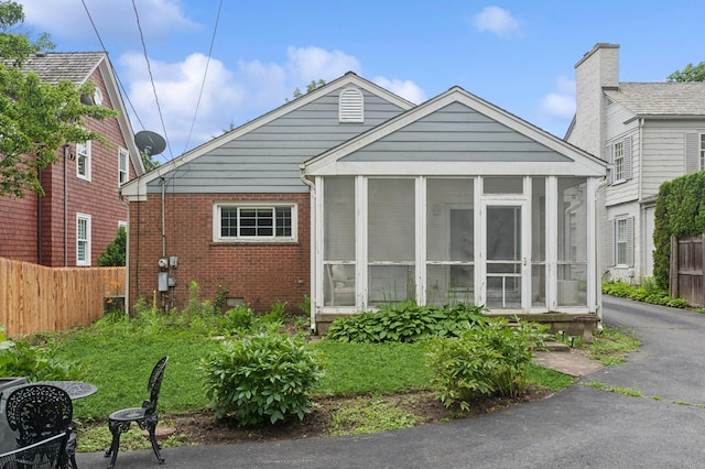72 Atteridge Rd, Lake Forest, IL 60045 - view of front of home featuring brick siding and a sunroom