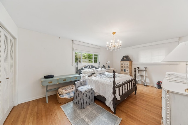 72 Atteridge Rd, Lake Forest, IL 60045 - bedroom featuring light wood-style flooring, a chandelier, and a closet