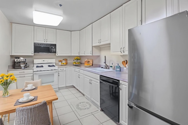 6411 Lincoln Ave Unit 412, Morton Grove, IL 60053 - kitchen featuring black appliances, light tile patterned floors, white cabinetry, and light countertops