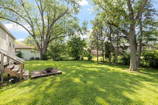 125 E Robinhood Way, Bolingbrook, IL 60440 - view of grassy yard with an outdoor fire pit