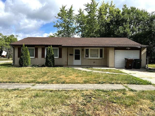 548 Landau Rd, University Park, IL 60484 - ranch-style home featuring a garage, brick siding, a front lawn, and concrete driveway