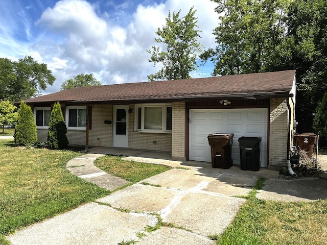 548 Landau Rd, University Park, IL 60484 - ranch-style home with an attached garage, concrete driveway, brick siding, a front yard, and a shingled roof