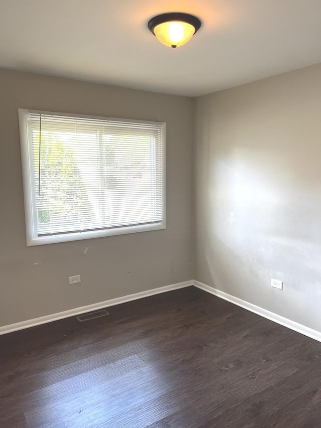 548 Landau Rd, University Park, IL 60484 - empty room featuring baseboards and dark wood-style floors