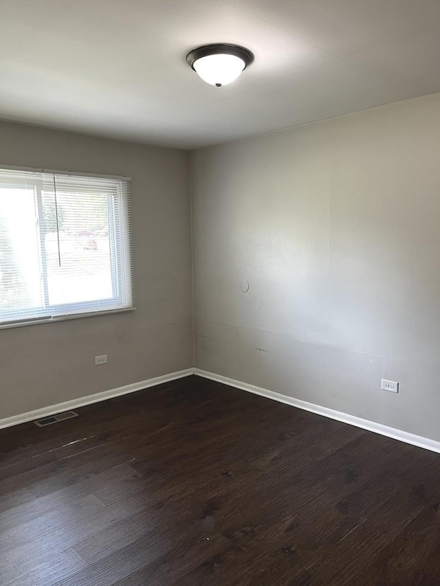 548 Landau Rd, University Park, IL 60484 - empty room featuring baseboards and dark wood-style flooring