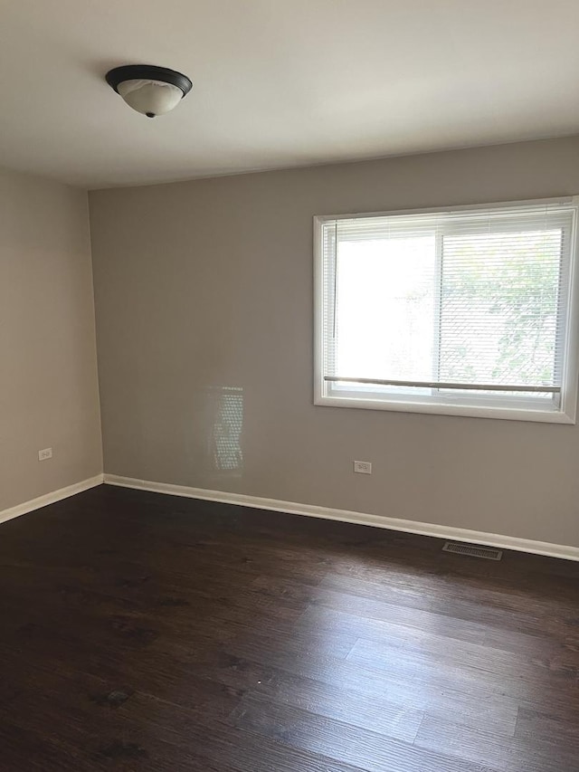 548 Landau Rd, University Park, IL 60484 - empty room featuring baseboards and dark wood-style floors