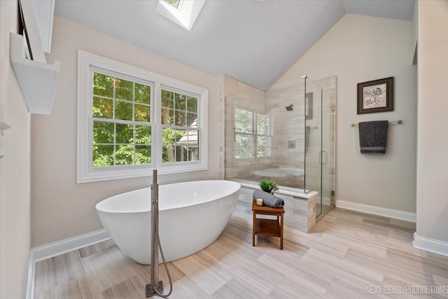 25660 N Countryside Dr, Lake Barrington, IL 60010 - full bathroom with a freestanding bath, a shower stall, lofted ceiling, and a skylight