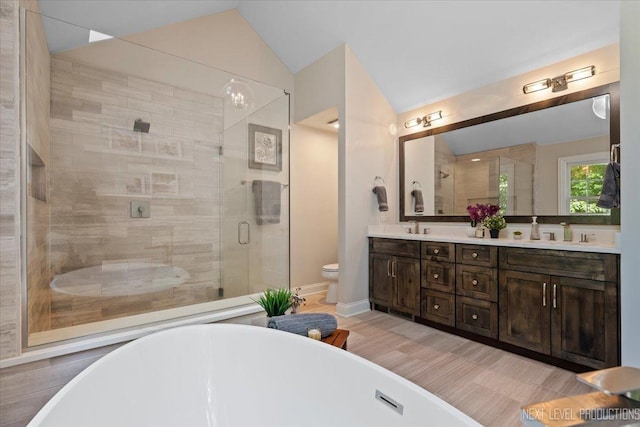 25660 N Countryside Dr, Lake Barrington, IL 60010 - bathroom with a soaking tub, double vanity, a stall shower, vaulted ceiling, and wood finished floors