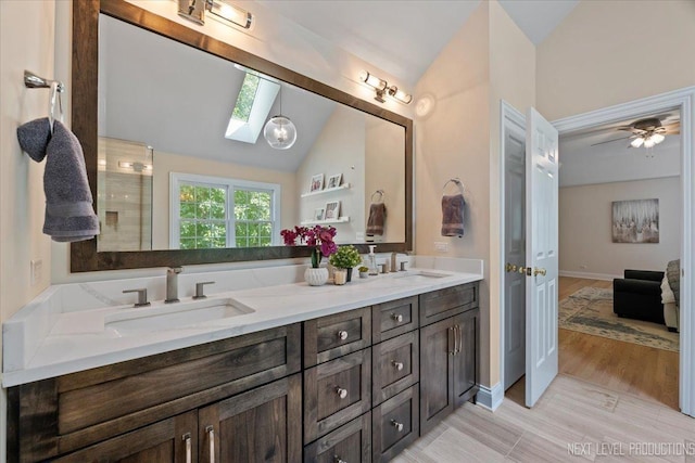 25660 N Countryside Dr, Lake Barrington, IL 60010 - full bathroom featuring a skylight, lofted ceiling, and double vanity