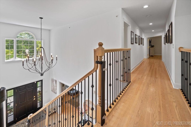 25660 N Countryside Dr, Lake Barrington, IL 60010 - corridor with a chandelier, light wood-style floors, recessed lighting, and an upstairs landing