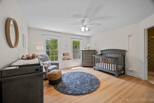 25660 N Countryside Dr, Lake Barrington, IL 60010 - bedroom with wood finished floors, ceiling fan, and a crib