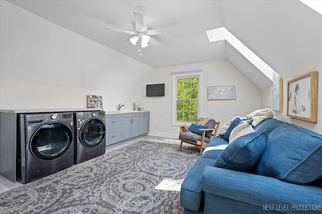 25660 N Countryside Dr, Lake Barrington, IL 60010 - laundry area featuring washing machine and dryer, cabinet space, a skylight, a ceiling fan, and wood finished floors