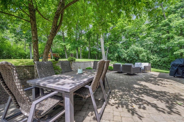 25660 N Countryside Dr, Lake Barrington, IL 60010 - view of patio with outdoor dining space, an outdoor hangout area, area for grilling, and view of wooded area
