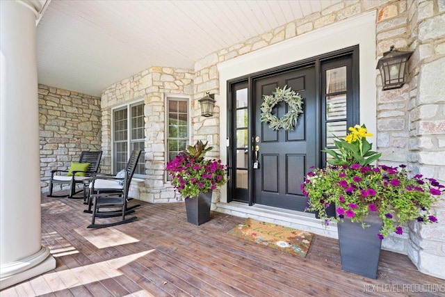 25660 N Countryside Dr, Lake Barrington, IL 60010 - view of exterior entry with a porch and stone siding