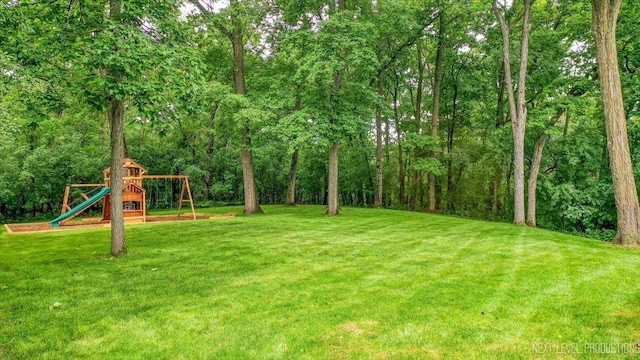25660 N Countryside Dr, Lake Barrington, IL 60010 - view of grassy yard featuring a playground and a wooded view