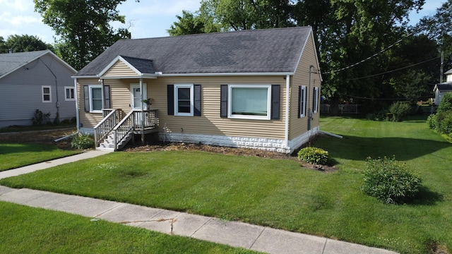 240 E 3rd Ave, Clifton, IL 60927 - view of front of home with a shingled roof and a front lawn