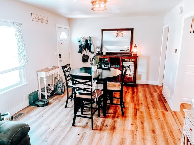 240 E 3rd Ave, Clifton, IL 60927 - dining area featuring light wood-type flooring and baseboards