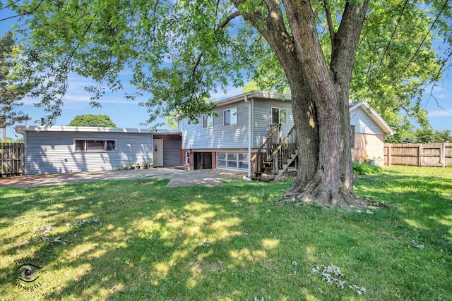 7235 174th Pl, Tinley Park, IL 60477 - back of property with a patio area, stairway, and brick siding